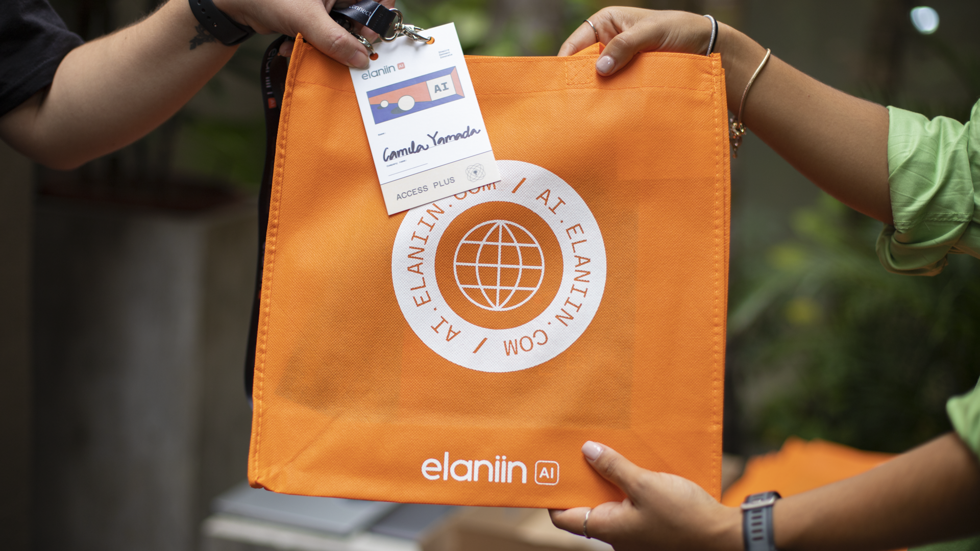 Elaniin AI '24 — welcome bag handoff